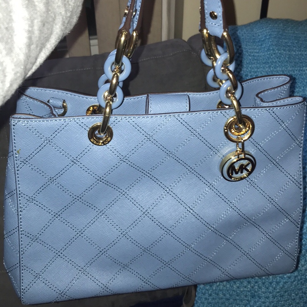 👜
